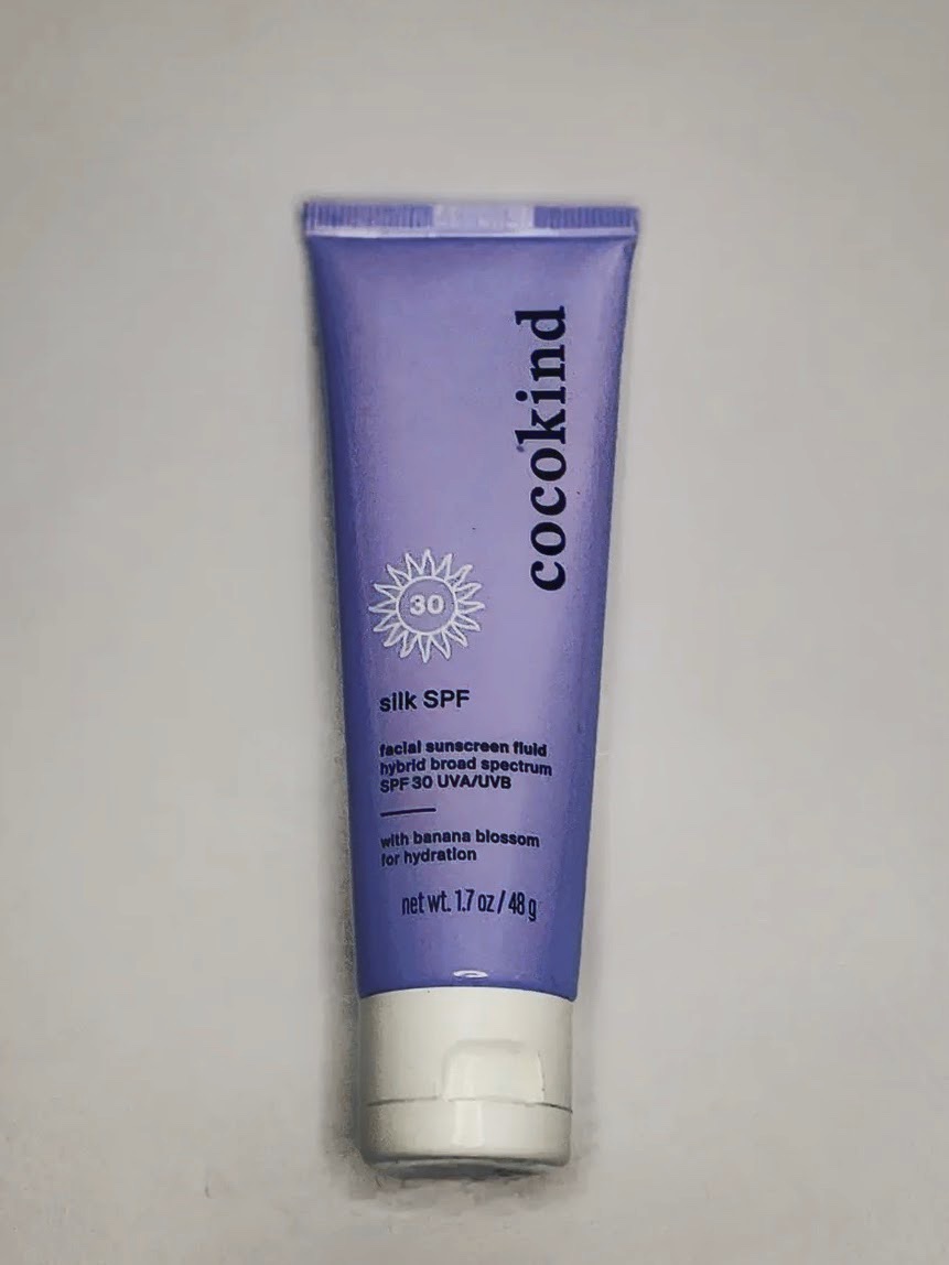 cocokind silk SPF 30 lavender tube standing upright on a soft white background